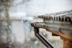 Snow Falls On The Roof Of The House Stock Photo Snow Falls On The Roof Of The House Stock Photo