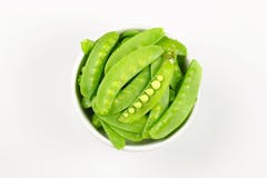 Snow peas or mange-tout, isolated on white background stock photos Snow peas or mange-tout, isolated on white background stock photos