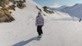 Snowboarder follow shot