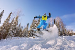 Snowboarder jumping from the springboard against the sky Stock Image Snowboarder jumping from the springboard against the sky Stock Image