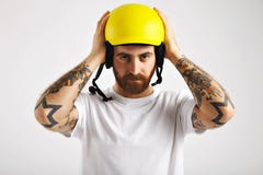 Snowboarder putting on and adjusting helmet stock image Snowboarder putting on and adjusting helmet stock image