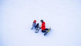 Snowboarding instructor with his student. Rest at the ski resort royalty free stock photo Snowboarding instructor with his student. Rest at the ski resort royalty free stock photo