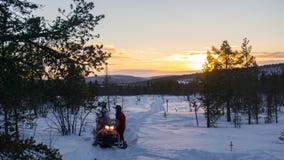 Snowmobiling in the Finnish Lapland stock image Snowmobiling in the Finnish Lapland stock image