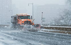 Snowplow Truck Cleans The Highways And Interstate During Blizzard Conditions During Nor`Easter In New England USA Royalty Free Stock Photos Snowplow Truck Cleans The Highways And Interstate During Blizzard Conditions During Nor`Easter In New England USA Royalty Free Stock Photos