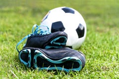 Soccer Ball And Shoes In Grass Stock Photography