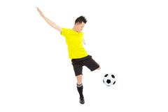 Soccer football player young man kicking ball royalty free stock photography Soccer football player young man kicking ball royalty free stock photography