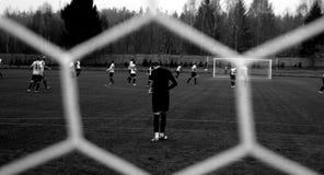 Soccer game through mesh net Soccer game through mesh net