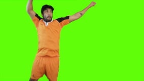 Soccer player heading a soccer ball on green background