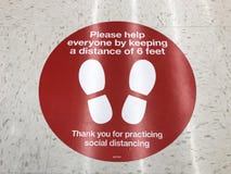 Social Distancing sign on the floor of Target supermarket