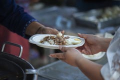 The society of helping to share food to the poor Royalty Free Stock Photo The society of helping to share food to the poor Royalty Free Stock Photo