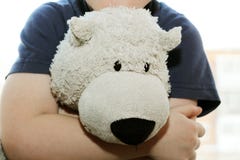 Soft bear toy in children`s hands so close royalty free stock image Soft bear toy in children`s hands so close royalty free stock image