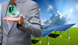Solar farm with businessman carry virtual world Stock Images Solar farm with businessman carry virtual world Stock Images