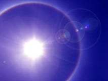 Solar halo. Sun surrounded by rainbow Solar halo. Sun surrounded by rainbow