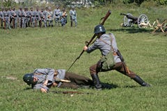 Soldiers In Attack Position Simulating A Kill Action Stock Image