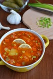 Solyanka mix soup with sausages, potatoes and lemon. Delicious Solyanka mix soup with sausages, potatoes and lemon royalty free stock images Solyanka mix soup with sausages, potatoes and lemon. Delicious Solyanka mix soup with sausages, potatoes and lemon royalty free stock images