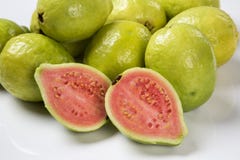Some brazilian guavas over a white background. Fresh fruits royalty free stock photo Some brazilian guavas over a white background. Fresh fruits royalty free stock photo