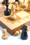Some Chessmen On A Chessboard Royalty Free Stock Image