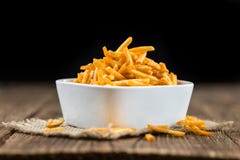 Some fried Potato Sticks (close-up shot). On an old wooden table royalty free stock photo Some fried Potato Sticks (close-up shot). On an old wooden table royalty free stock photo