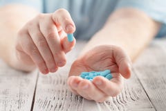 Someone holding a hand full of medical pills stock images Someone holding a hand full of medical pills stock images