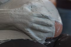 Someone puts plaster on the belly of a expectant young mothe royalty free stock image Someone puts plaster on the belly of a expectant young mothe royalty free stock image