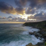 Sommarsolnedgång från det Wybung huvudet i den Munmorrah tillståndsnaturvårdsområdet, central kust, NSW, Australien arkivfoto Sommarsolnedgång från det Wybung huvudet i den Munmorrah tillståndsnaturvårdsområdet, central kust, NSW, Australien arkivfoto
