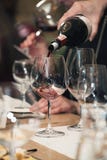 Sommelier Pouring Wine Into Glass At Wine Tasting Royalty Free Stock Images