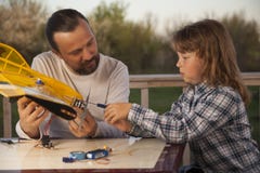 Son and father made homemade radio-controlled model aircraft ai royalty free stock images Son and father made homemade radio-controlled model aircraft ai royalty free stock images