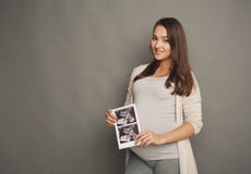 Sonography μωρών εγκύων γυναικών withher στοκ φωτογραφία με δικαίωμα ελεύθερης χρήσης Sonography μωρών εγκύων γυναικών withher στοκ φωτογραφία με δικαίωμα ελεύθερης χρήσης