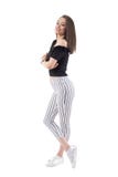 Sophisticated young beautiful girl with crossed arms smiling and looking away. Stock Image Sophisticated young beautiful girl with crossed arms smiling and looking away. Stock Image