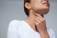 Sore Throat. Closeup Beautiful Woman Hands And Neck. Throat Pain stock image Sore Throat. Closeup Beautiful Woman Hands And Neck. Throat Pain stock image