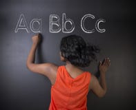 South African or African American woman teacher or student learn alphabet write writing Royalty Free Stock Photography South African or African American woman teacher or student learn alphabet write writing Royalty Free Stock Photography