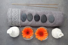 Spa massage setting with rolled towel, thai herbal compress balls and flowers. Flat lay. Top view royalty free stock photo Spa massage setting with rolled towel, thai herbal compress balls and flowers. Flat lay. Top view royalty free stock photo