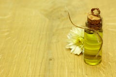 SPA organic flowers massage oil in handmade bottle stock photos SPA organic flowers massage oil in handmade bottle stock photos