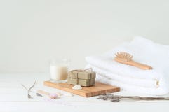 Spa products on light wooden background