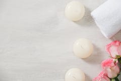 Spa settings with roses. Spa theme with candles and flowers on t stock image Spa settings with roses. Spa theme with candles and flowers on t stock image