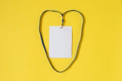 Empty ID card badge icon with blue belt in heart shape on yellow background. stock photos Empty ID card badge icon with blue belt in heart shape on yellow background. stock photos