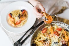Spaghetti, shrimp paste in the pan. Top view, white background. stock photo Spaghetti, shrimp paste in the pan. Top view, white background. stock photo