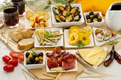 Spanish Cuisine. Variety of tapas on white plates. royalty free stock photo Spanish Cuisine. Variety of tapas on white plates. royalty free stock photo
