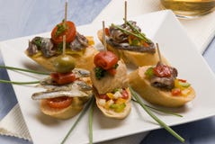 Spanish tapas. Bread slices mounted with tuna.