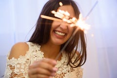 Sparkler. Female hands holding bengal light. Woman holding bright festive Christmas sparkler in hand stock image Sparkler. Female hands holding bengal light. Woman holding bright festive Christmas sparkler in hand stock image