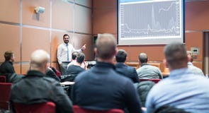 Skiled Public Speaker Giving a Talk at Business Meeting. royalty free stock images Skiled Public Speaker Giving a Talk at Business Meeting. royalty free stock images