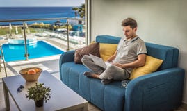 IT specialist, businessman working at home with his computer, laptop online training, distance learning courses. Student does e- royalty free stock photography IT specialist, businessman working at home with his computer, laptop online training, distance learning courses. Student does e- royalty free stock photography