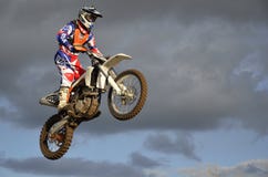 The spectacular jump moto racer on a motorcycle Stock Photos The spectacular jump moto racer on a motorcycle Stock Photos
