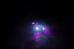 Speed lighting of police car in the night on the road. Police cars on road moving with fog. Selective focus. Chase. Speed lighting of police car in the night on royalty free stock images Speed lighting of police car in the night on the road. Police cars on road moving with fog. Selective focus. Chase. Speed lighting of police car in the night on royalty free stock images