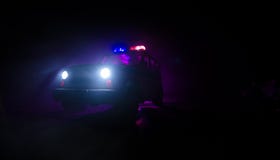Speed lighting of police car in the night on the road. Police cars on road moving with fog. Selective focus. Chase. Speed lighting of police car in the night on royalty free stock photos Speed lighting of police car in the night on the road. Police cars on road moving with fog. Selective focus. Chase. Speed lighting of police car in the night on royalty free stock photos