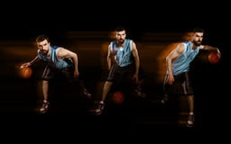 Spelare som dreglar en basket arkivfoton Spelare som dreglar en basket arkivfoton