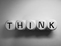 Word think spelled on dice stock photography Word think spelled on dice stock photography