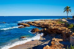 Spiaggia di Denia Las Rotas Rotes nel Mediterraneo di Alicante immagini stock Spiaggia di Denia Las Rotas Rotes nel Mediterraneo di Alicante immagini stock