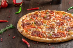 Spicy pizza Diablo near peppers close-up stock images Spicy pizza Diablo near peppers close-up stock images