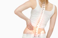 Spina dorsale evidenziata della donna con dolore alla schiena fotografia stock Spina dorsale evidenziata della donna con dolore alla schiena fotografia stock